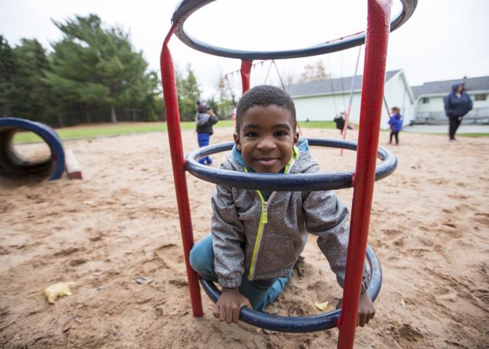 a young boy in a playground