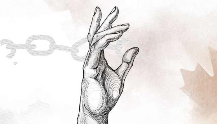 a hand raised up in a gesture of freedom