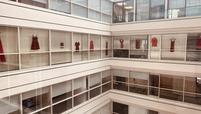 red dresses hang in the windows of the NS Human Rights Commisison office in Halifax